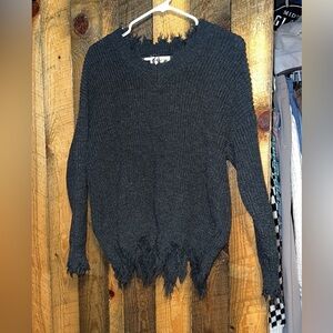 Stylish distressed sweater